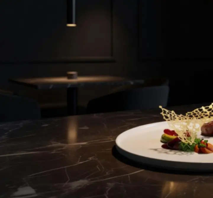 Signature fine dining dish presented at Aus Nights under cinematic lighting